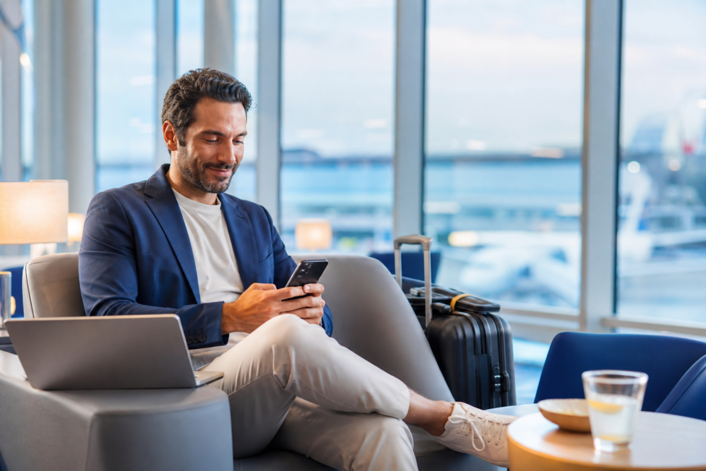 sim card for data only: traveler using mobile internet at the airport
